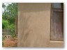 But one exposed wall took the strong rain and survived to tell us our plaster recipe works!