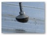 Sheets were held down by J-bolts fitted with bitumen gaskets under a cup washer