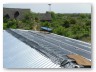 Bitumen sheet was rolled out on the corrugated sheets and tiles salvaged from old homes