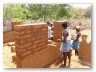 Bricks being large, the walls came up quickly.